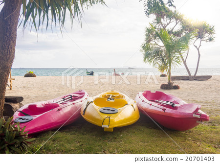 Kayak boats under a tree Kayak boats under a tree 20701403