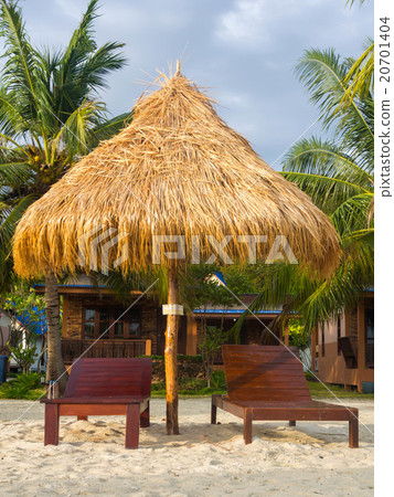 Wooden beach chairs with thatch umbrella Wooden beach chairs with thatch umbrella 20701404