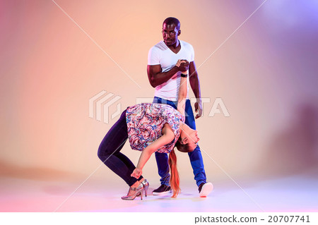Young couple dances social Caribbean Salsa, studio Young couple dances social Caribbean Salsa, studio 20707741