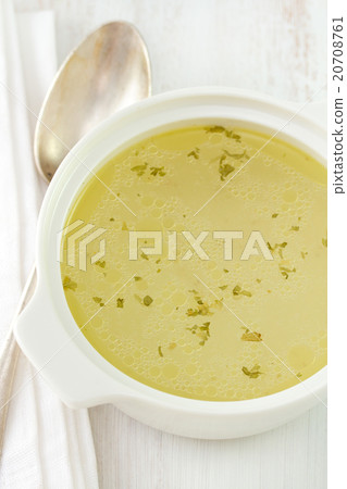 chicken broth in bowl with spoon chicken broth in bowl with spoon 20708761