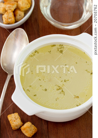 chicken broth in white bowl chicken broth in white bowl 20708762