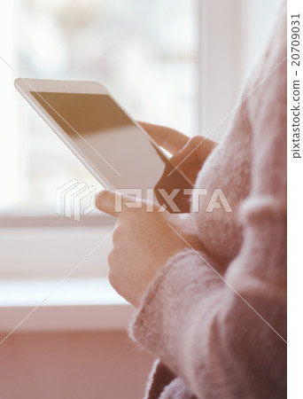 girl with the tablet at the window girl with the tablet at the window 20709031