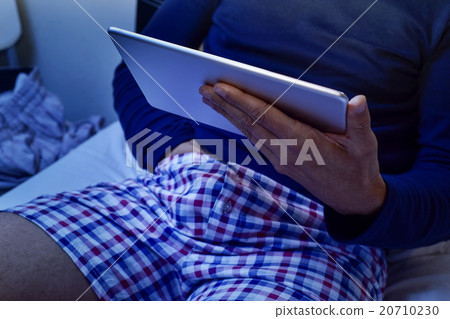 man with his hand under his underware watching 20710230