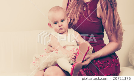 Happy baby girl on mother knees. Happy baby girl on mother knees. 20711376