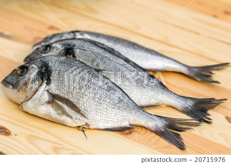 Fish on wooden background 20715976