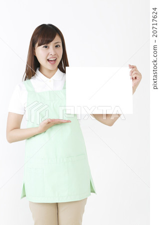 A woman in an apron A woman in an apron 20717624