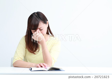 A woman scooping at the notebook A woman scooping at the notebook 20721823