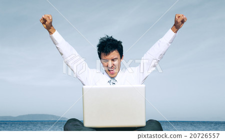 Business man on beach with laptop Concept Business man on beach with laptop Concept 20726557