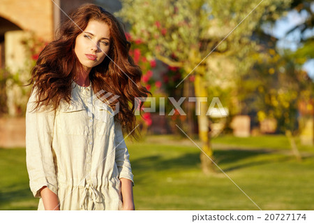 Woman in summer field. Young girl relax outdoors. Woman in summer field. Young girl relax outdoors. 20727174