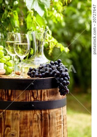 Bottle of white wine with wineglass and grapes Bottle of white wine with wineglass and grapes 20727647