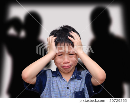 Crying boy with his fighting parents 20729263