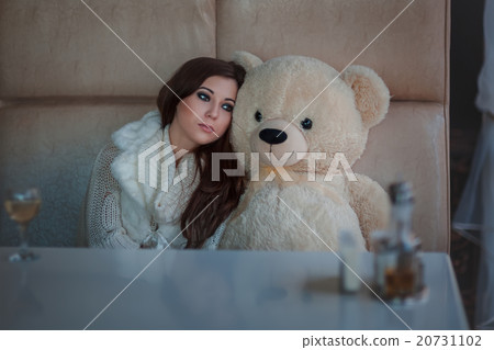 Sad girl with toy bear. Sad girl with toy bear. 20731102