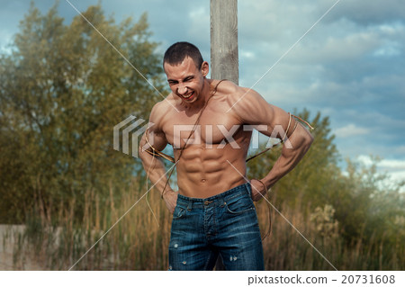 Man tied to a pillar. Man tied to a pillar. 20731608