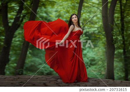 Girl in red on the edge of a precipice. Girl in red on the edge of a precipice. 20731615