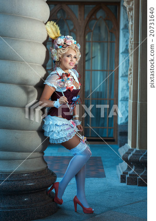 Girl in ancient dress standing near vintage column. Girl in ancient dress standing near vintage column. 20731640