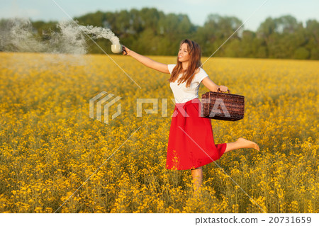 Girl holding a cup of magic smoke. Girl holding a cup of magic smoke. 20731659