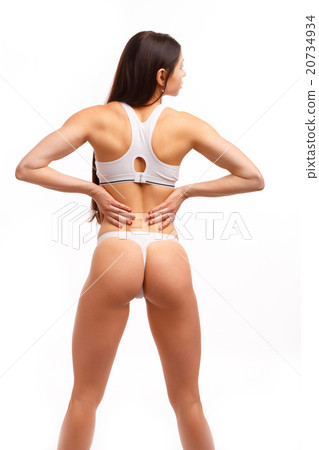 Young female touching her painful back 20734934
