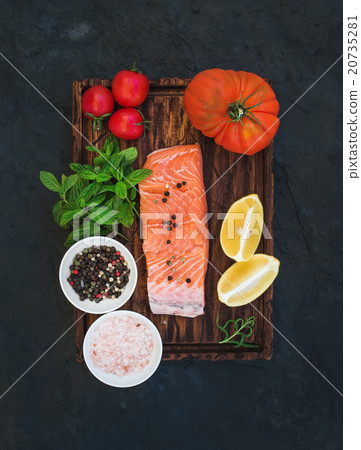 Ingredients. Raw salmon filet, lemon, cherry and 20735281