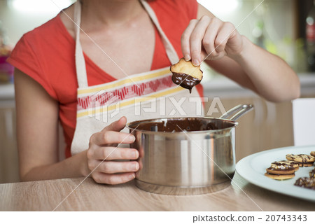 Woman is making christmas cakes Woman is making christmas cakes 20743343
