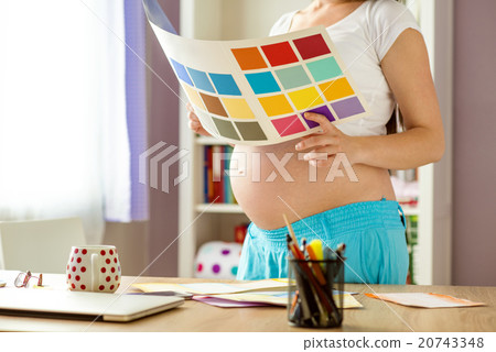 Pregnant woman working from home Pregnant woman working from home 20743348