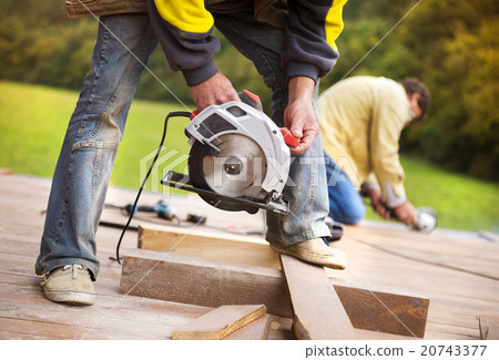 Carpenter grinding wooden planks Carpenter grinding wooden planks 20743377