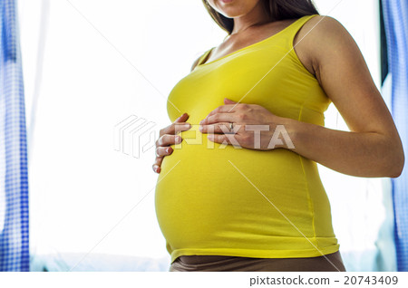 Pregnant woman at home 20743409