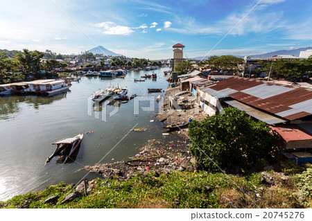 poor houses by the river in shantytown 20745276