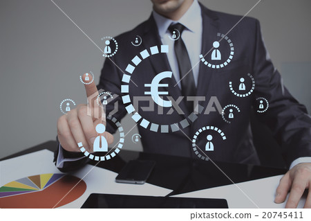 Businessman pushing virtual button eur Businessman pushing virtual button eur 20745411