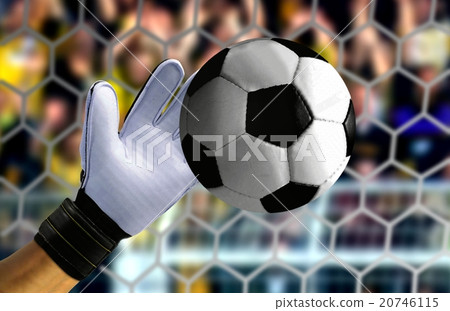 Goal keeper hand stopping a fast ball Goal keeper hand stopping a fast ball 20746115