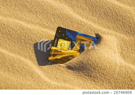 Credit card in the sand 20746909