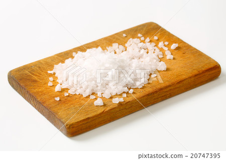 Coarse sea salt on cutting board Coarse sea salt on cutting board 20747395