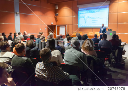 Public speaker giving talk at Business Event. 20748976