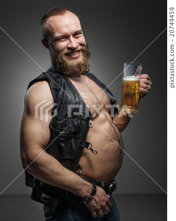 Smiling biker with beer belly. Smiling biker with beer belly. 20749459