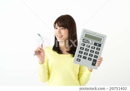 A woman holding a LAN cable and a calculator 20751402