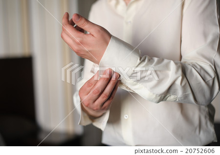 Man cufflink buttons on a white shirt 20752606