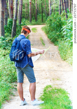 Young man is exploring the map Young man is exploring the map 20753797