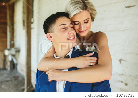 Bride embraces bridegroom 20755733
