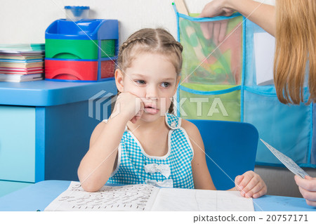 Five-year girl thought doing spelling under the supervision of a tutor Five-year girl thought doing spelling under the supervision of a tutor 20757171