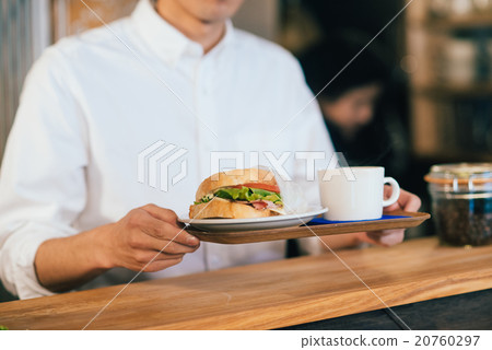 A man working at a cafe A man working at a cafe 20760297