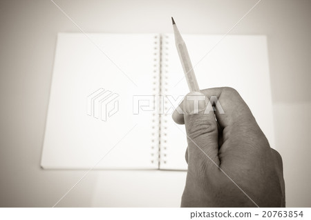 Hand holding a pencil, Vintage effect Hand holding a pencil, Vintage effect 20763854