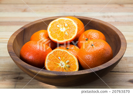 Fresh oranges in wooden bowl. Fresh oranges in wooden bowl. 20763870