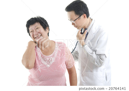 Image of a doctor and his nurse checking up a senior patient in Image of a doctor and his nurse checking up a senior patient in 20764141