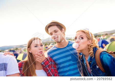 Teenagers at summer music festival blowing buble Teenagers at summer music festival blowing buble 20769562