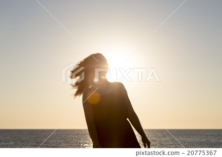 sunset and silhouette of a teenage girl in motion sunset and silhouette of a teenage girl in motion 20775367