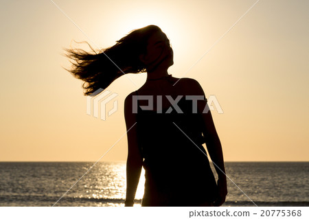 sunset and silhouette of a teenage girl in motion sunset and silhouette of a teenage girl in motion 20775368