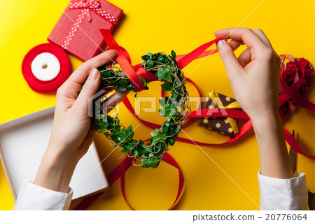 Female hands are holding a gift 20776064