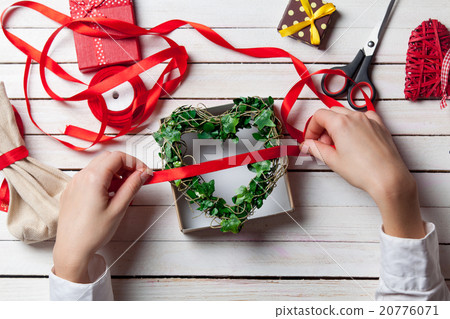 Female hands are holding gift 20776071