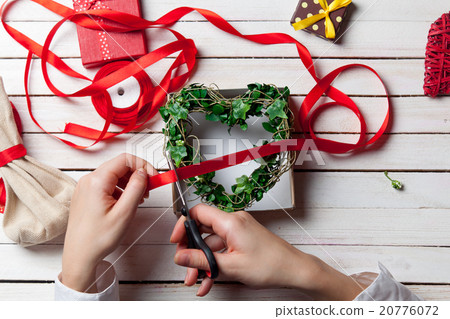 Female hands are holding gift 20776072