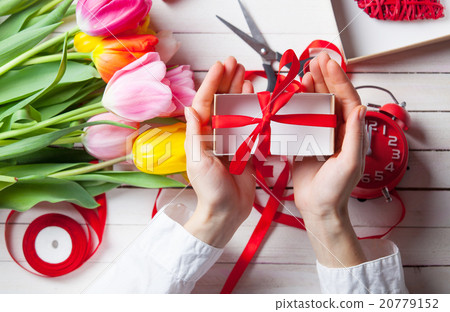 Female hands are holding a gift 20779152