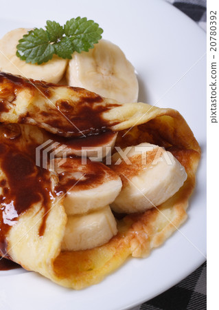 pancake with banana vertical on the table. Macro pancake with banana vertical on the table. Macro 20780392